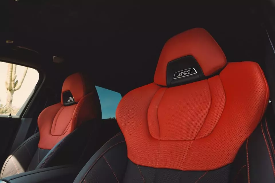 Similar to the exterior, the seats on the XM Label Red are contrasted with red and black, accompanied by red decorative stitching and XM logo on the headrest.